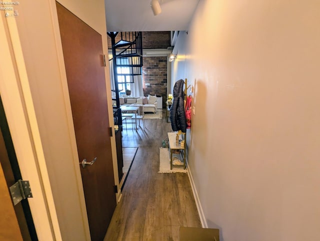 hallway with dark hardwood / wood-style floors