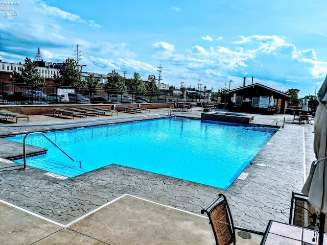 view of swimming pool featuring a patio