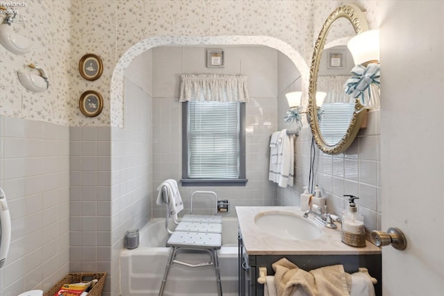 bathroom with tile walls and vanity