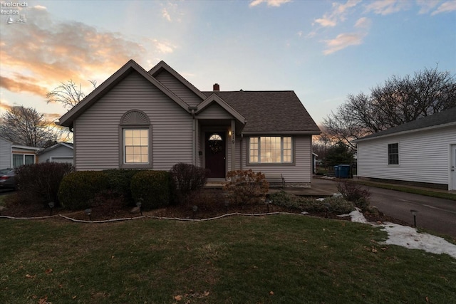 view of front of property with a yard