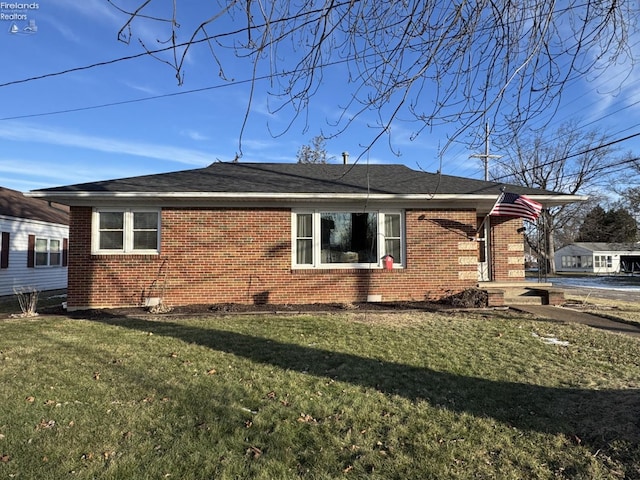 view of home's exterior featuring a yard