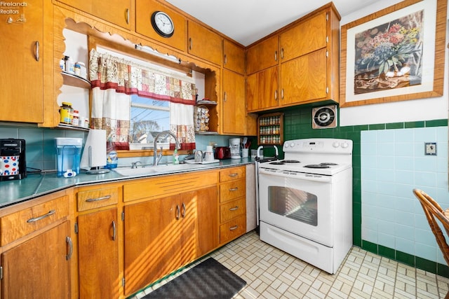 kitchen featuring tile walls, sink, and white electric range