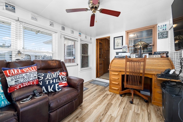 home office with ceiling fan and light wood-type flooring