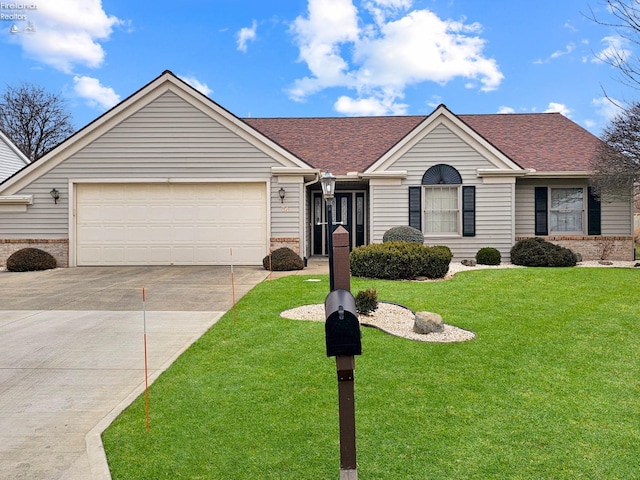 single story home featuring a garage and a front yard