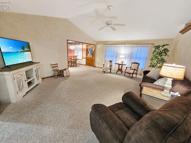 carpeted living room with lofted ceiling and ceiling fan