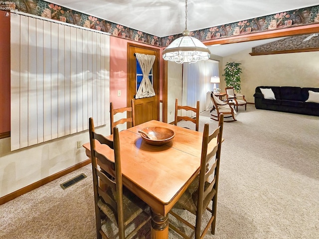 view of carpeted dining area