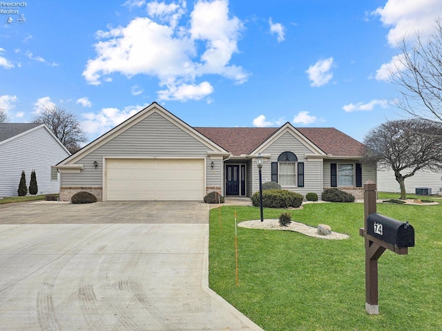 single story home featuring a garage and a front yard