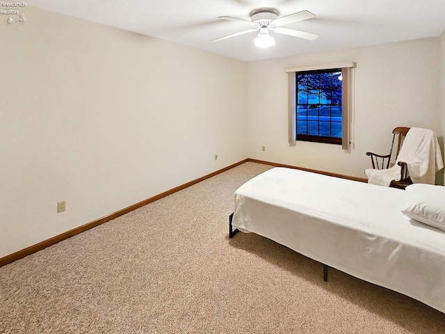 bedroom featuring ceiling fan and carpet flooring