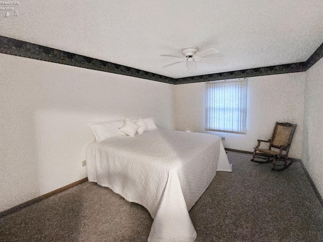 carpeted bedroom with ceiling fan and a textured ceiling