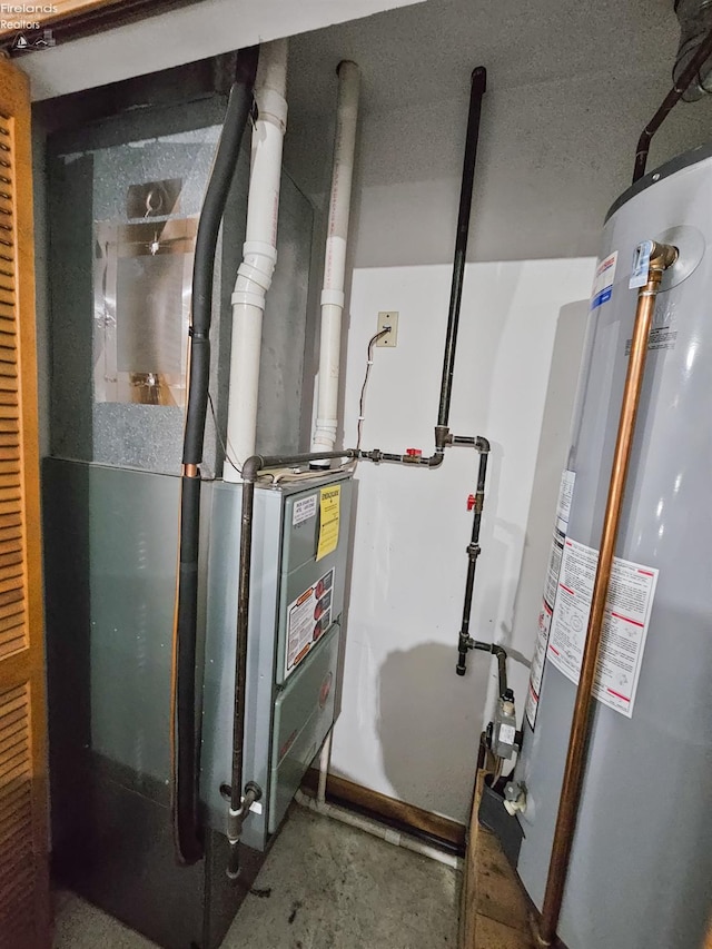 utility room with heating unit and water heater