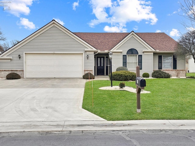 ranch-style house featuring a garage and a front yard