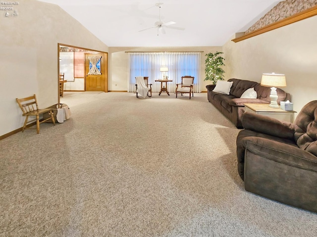 carpeted living room with ceiling fan and lofted ceiling