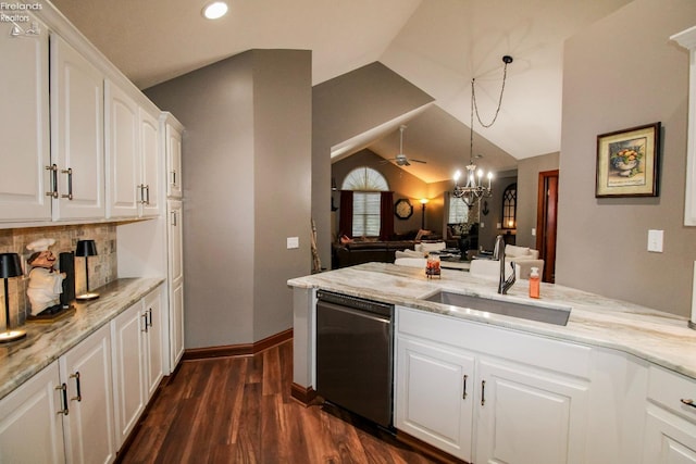 kitchen featuring sink, light stone counters, decorative light fixtures, dishwasher, and white cabinets