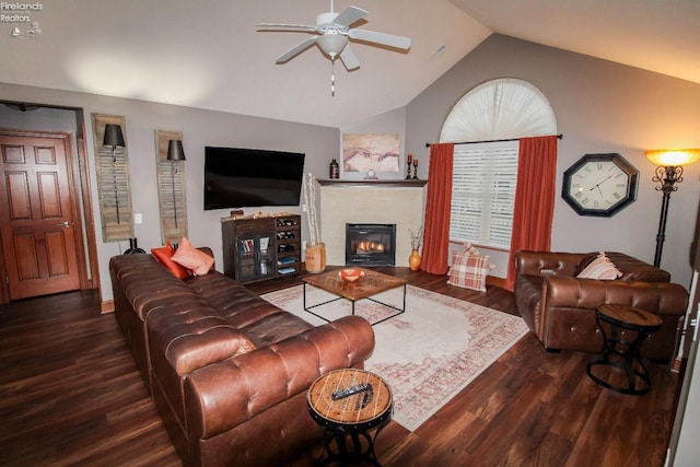 living room with lofted ceiling, dark hardwood / wood-style floors, and ceiling fan