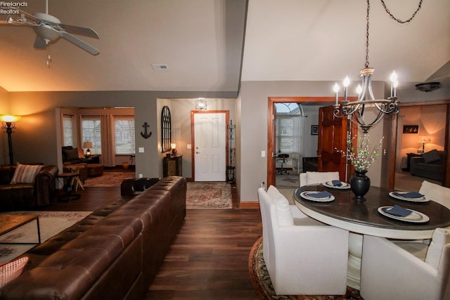 living room featuring wood-type flooring, vaulted ceiling, and ceiling fan with notable chandelier