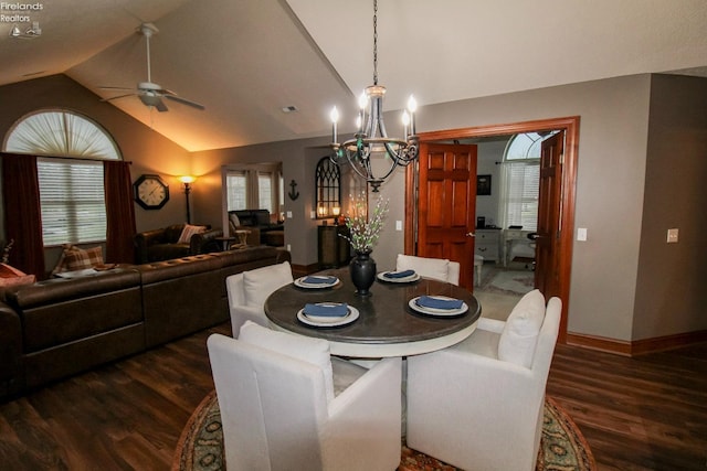 dining room with dark hardwood / wood-style flooring, vaulted ceiling, and a wealth of natural light