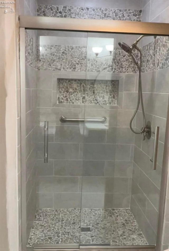 bathroom with an enclosed shower