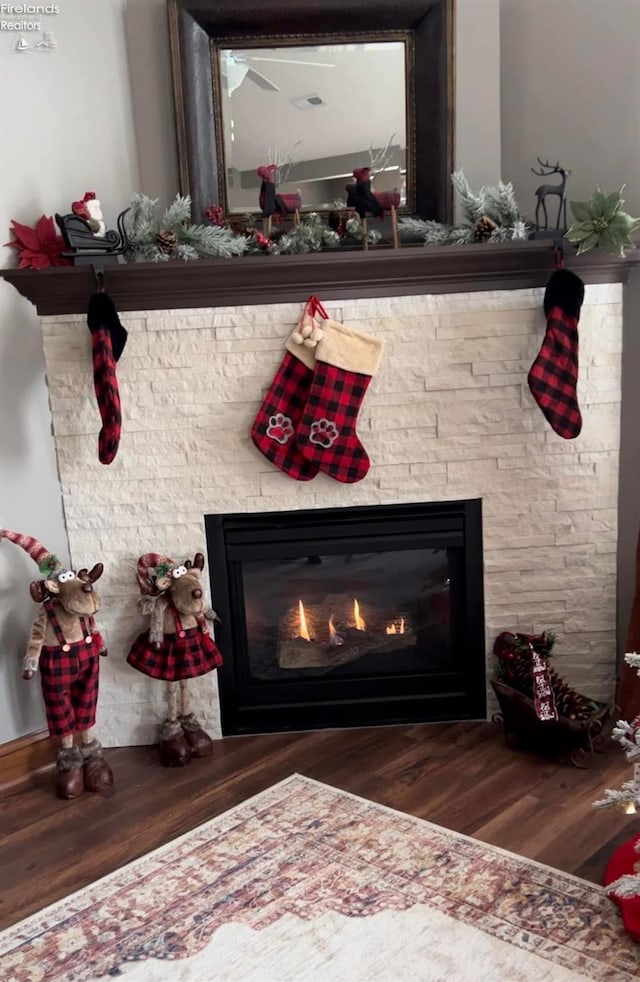 interior details with hardwood / wood-style floors and a fireplace