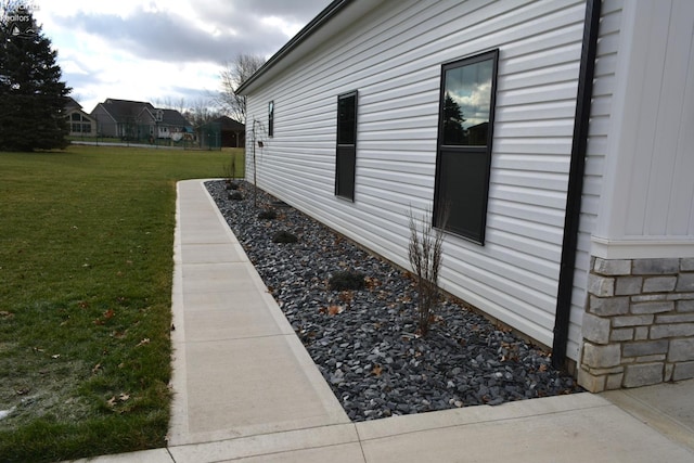 view of home's exterior featuring a yard