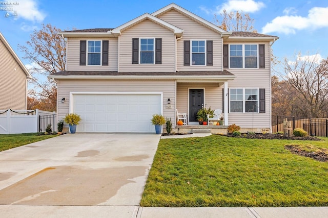 view of front of home featuring a garage and a front lawn