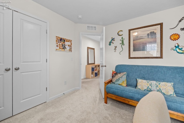 living area with light carpet