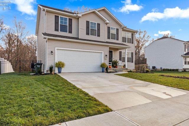 view of front of home with a garage and a front lawn