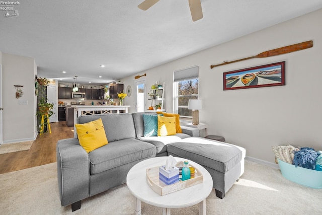 living room featuring ceiling fan