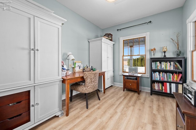 office with light hardwood / wood-style flooring