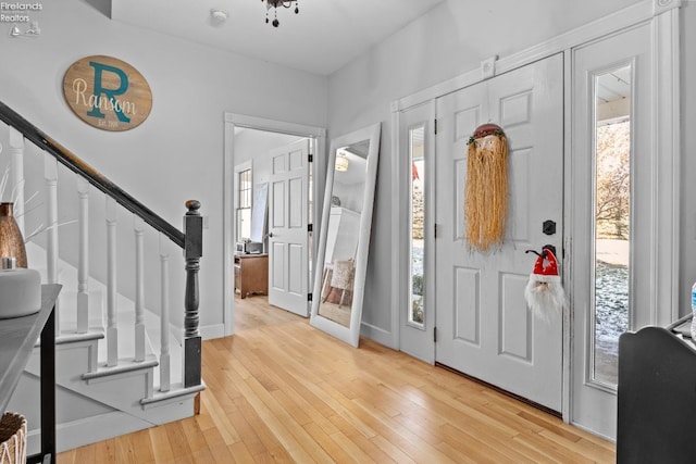 entryway with light hardwood / wood-style floors