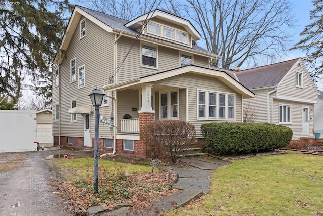 view of front of property with a front yard and a porch