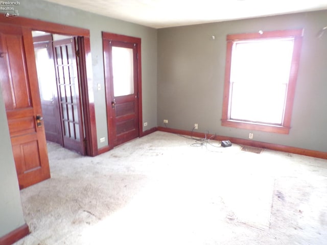 view of carpeted foyer