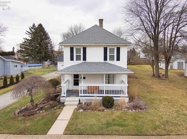 view of front of property with a porch and a front yard