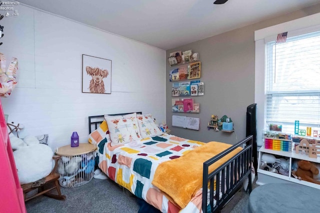 bedroom featuring dark colored carpet