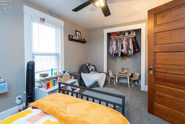 bedroom featuring carpet flooring, ceiling fan, and a closet