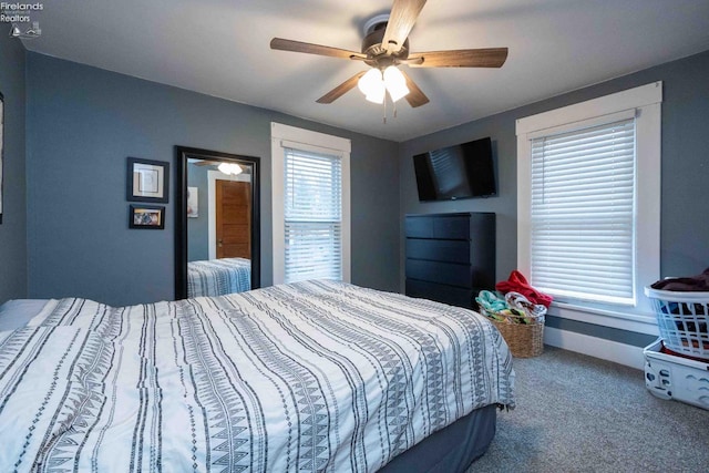 carpeted bedroom with ceiling fan