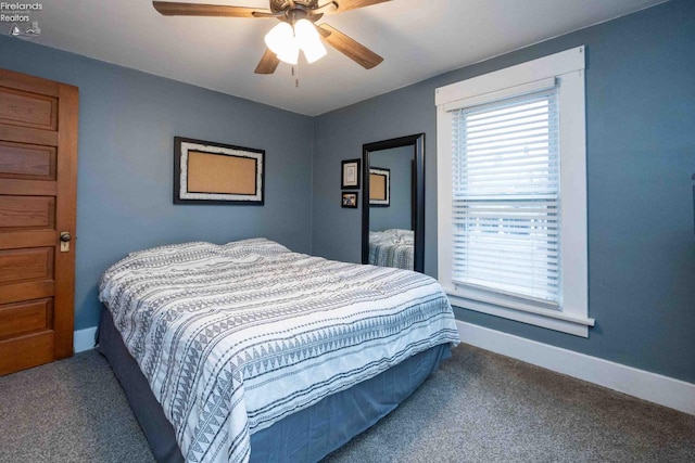 bedroom with ceiling fan and carpet