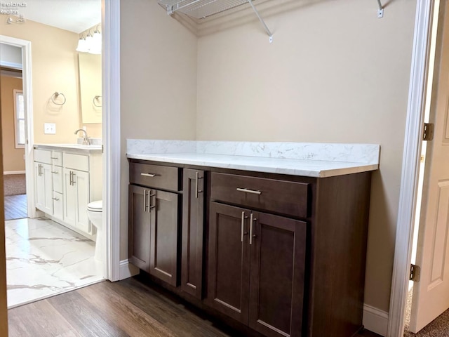 bathroom with vanity, wood-type flooring, and toilet