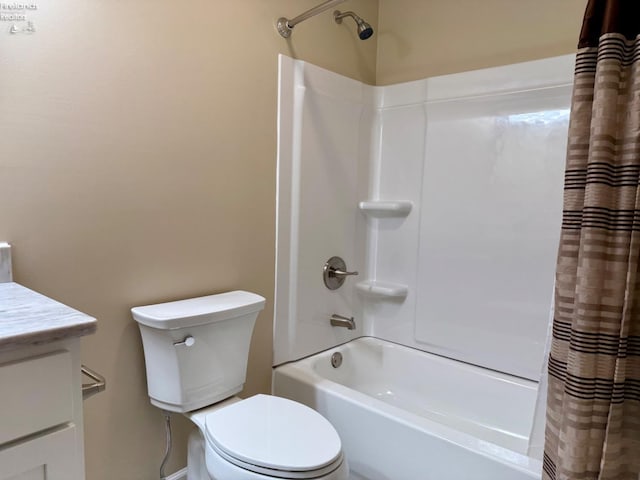 full bathroom featuring vanity, shower / tub combo with curtain, and toilet