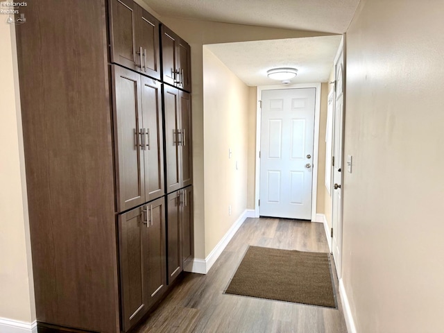 entryway with hardwood / wood-style flooring and a textured ceiling