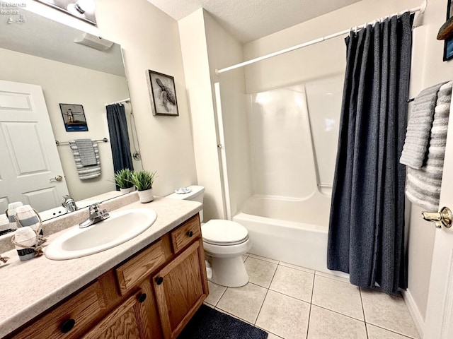 full bathroom featuring toilet, a textured ceiling, vanity, shower / bath combo, and tile patterned flooring