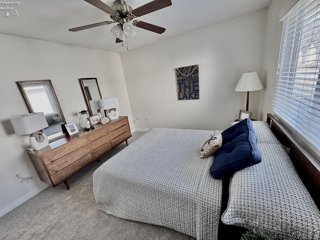 bedroom with ceiling fan and carpet flooring