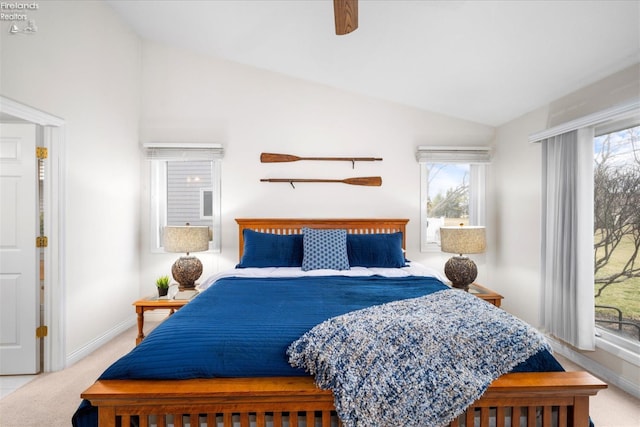 bedroom featuring ceiling fan, light colored carpet, and lofted ceiling