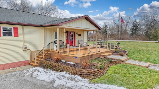 view of front of property with a porch and a front yard