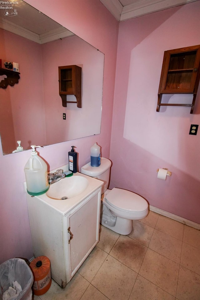 bathroom featuring ornamental molding, vanity, tile patterned floors, and toilet