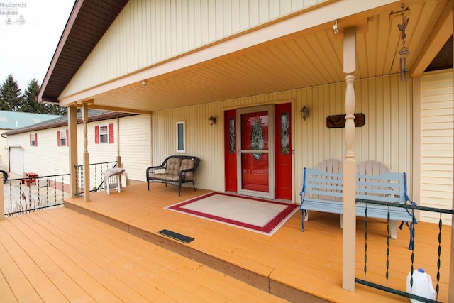 wooden terrace with a porch