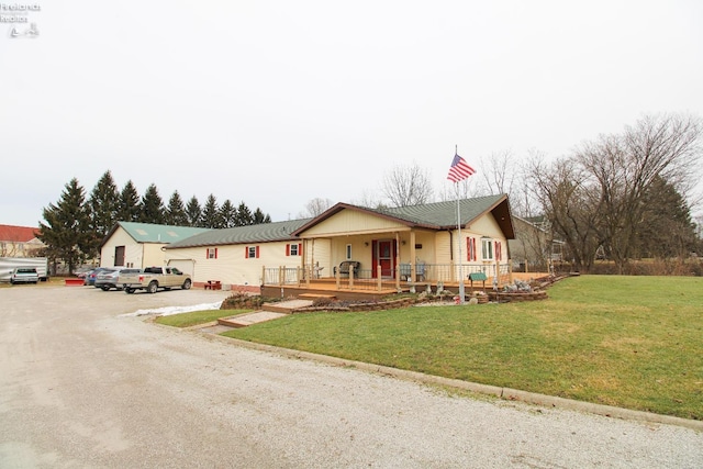 ranch-style home with a front lawn and covered porch