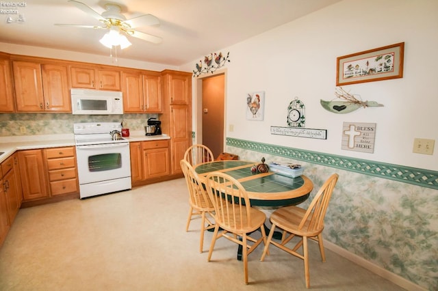 kitchen with ceiling fan and white appliances