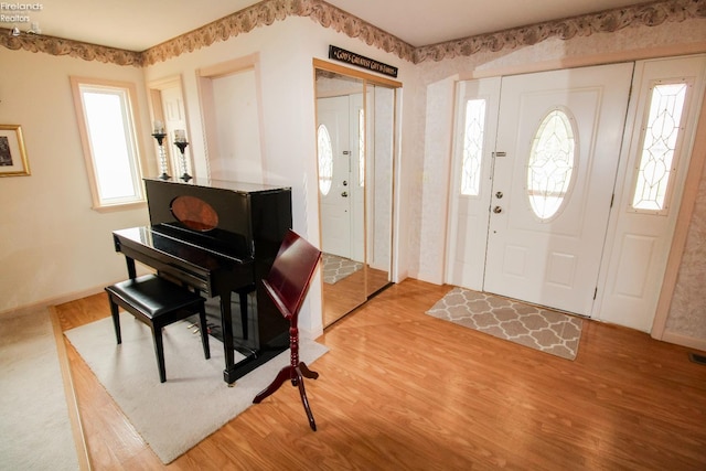 entryway with hardwood / wood-style floors