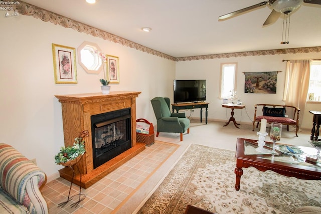 carpeted living room featuring ceiling fan and a wealth of natural light