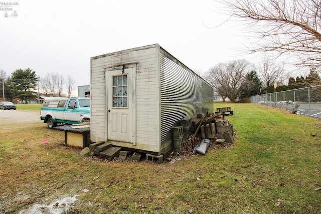 view of outdoor structure featuring a lawn